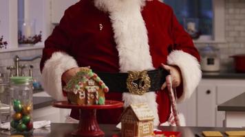 Santa Claus in kitchen putting on apron video