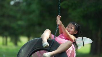 Girl in fairy princess costume on tire swing, shot on Phantom Flex 4K video