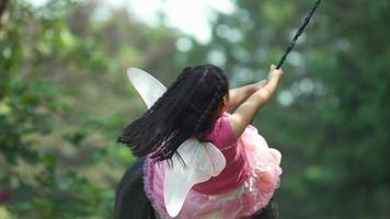 Girl in fairy princess costume on tire swing, shot on Phantom Flex 4K video