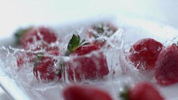 Strawberries splashing in slow motion video