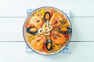 Seafood Paella with prawns, clams, mussels on saffron rice photo