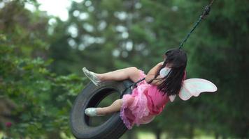 Girl in fairy princess costume on tire swing, shot on Phantom Flex 4K video
