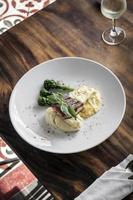 Grilled salmon fish fillet with mashed potato and dijon mustard cream sauce photo