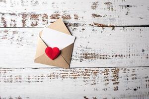 Blank Letter on wood background, valentine's day concept. photo