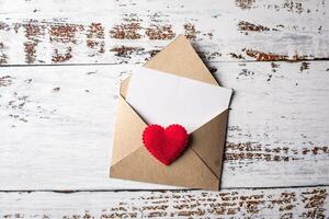 Blank Letter on wood background, valentine's day concept. photo