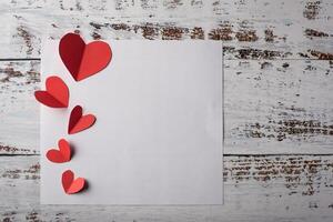 Top view Red heart on wood background. photo