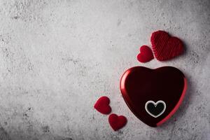 Top view Red heart on wall background. photo