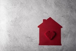 Paper house with heart flat design. photo