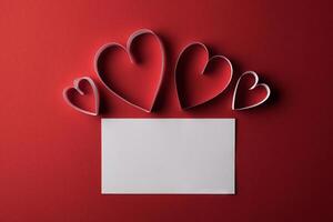 Red Heart paper and blank with note card on Red background. photo