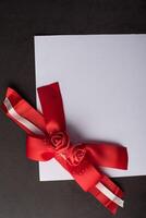 Rose ribbon with white paper. photo