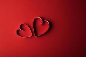 Red Hearts paper on Red background photo
