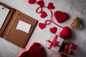 Top view Blank white card on wallet and heart gift. photo