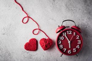 Red alarm clock with Red heart, Valentines day concept. photo