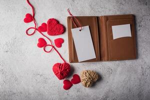 Top view Blank white card on wallet and heart gift. photo