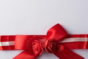 Rose ribbon with white paper. photo