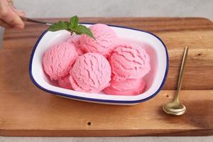 Food stylist use tweezers decorating fake icecream photo