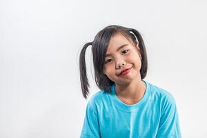 Portrait of Funny little girl acting in studio shot. photo