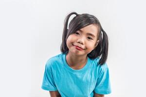 Portrait of Funny little girl acting in studio shot. photo