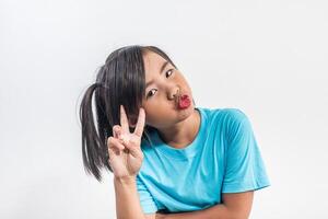 Portrait of Funny little girl acting in studio shot. photo