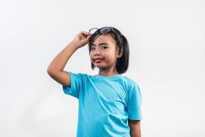 Portrait of Funny little girl acting in studio shot. photo