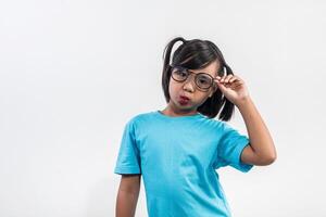 Portrait of Funny little girl acting in studio shot. photo