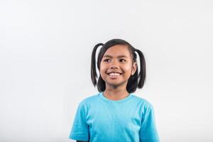 Portrait of Funny little girl acting in studio shot. photo