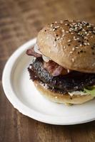 Australian organic beef burger with bacon on wood table background