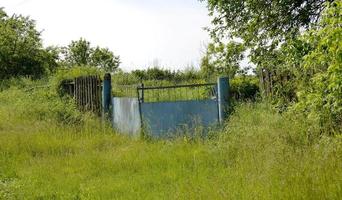 Beautiful old gate from abandoned house in village photo