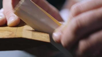 Wood Craftsman Grinds Teeth on A Wooden Comb video