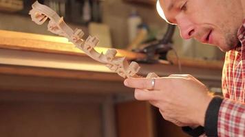 Young man work with wood, carpenter at work video