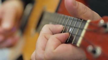 Playing the Strings of A Ukulele video