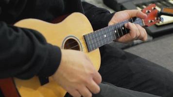 A Man Tunes a Ukulele video