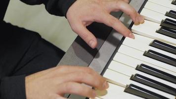 Overhead of A Man Playing on A Synth Piano video