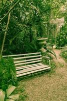 Old bench in park - vintage effect filter photo