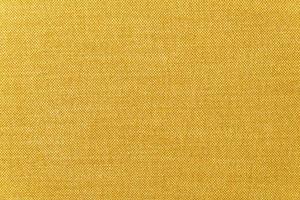 Primer plano de textura de la superficie de la tela mostaza amarilla o dorada para el fondo