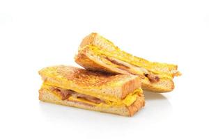 French toast ham, bacon, and cheese sandwich with egg isolated on white background