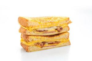 French toast ham, bacon, and cheese sandwich with egg isolated on white background