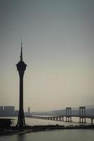 Macau tower and Taipa bridge area skyline view on foggy day in China photo