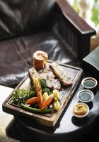 Gourmet Sunday roast beef traditional British meal set on old wooden pub table