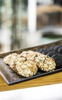 Mixed fresh organic oat biscuit cookies in bakery display photo