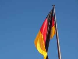 German flag over blue sky photo