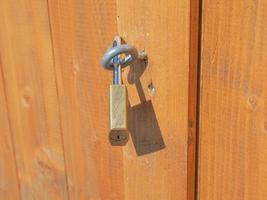 Padlock on a wood door photo