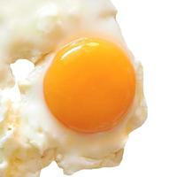 Fried egg isolated over white with copy space photo