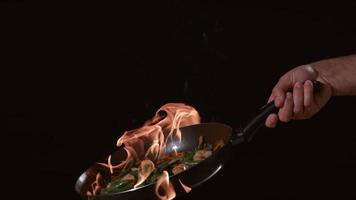 Flaming stir-fry in slow motion