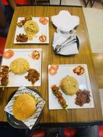 fried rice and burger on the table photo