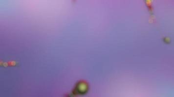 Abstract blurred lilac background with multicolored bokeh. video