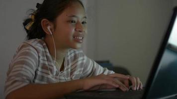Schoolgirl studying from home with video call online during COVID-19.