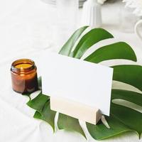 Menu or stand for booklet on tropical leaf on restaurant table photo