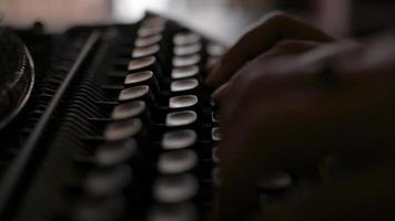 Close up hands of woman typing on retro typewriter during working. video