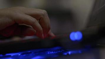 Hands of woman typing laptop keyboard during working hour on the desk. video